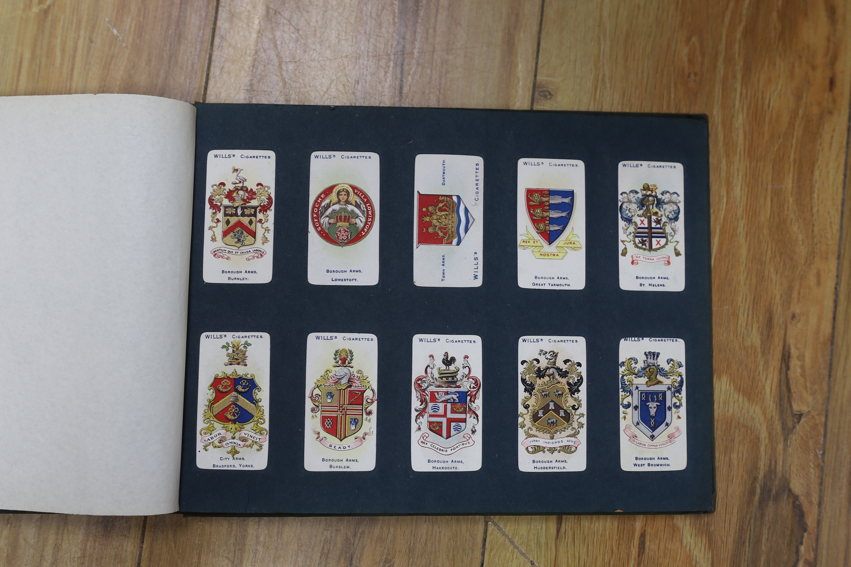 A collection of cigarette cards in albums